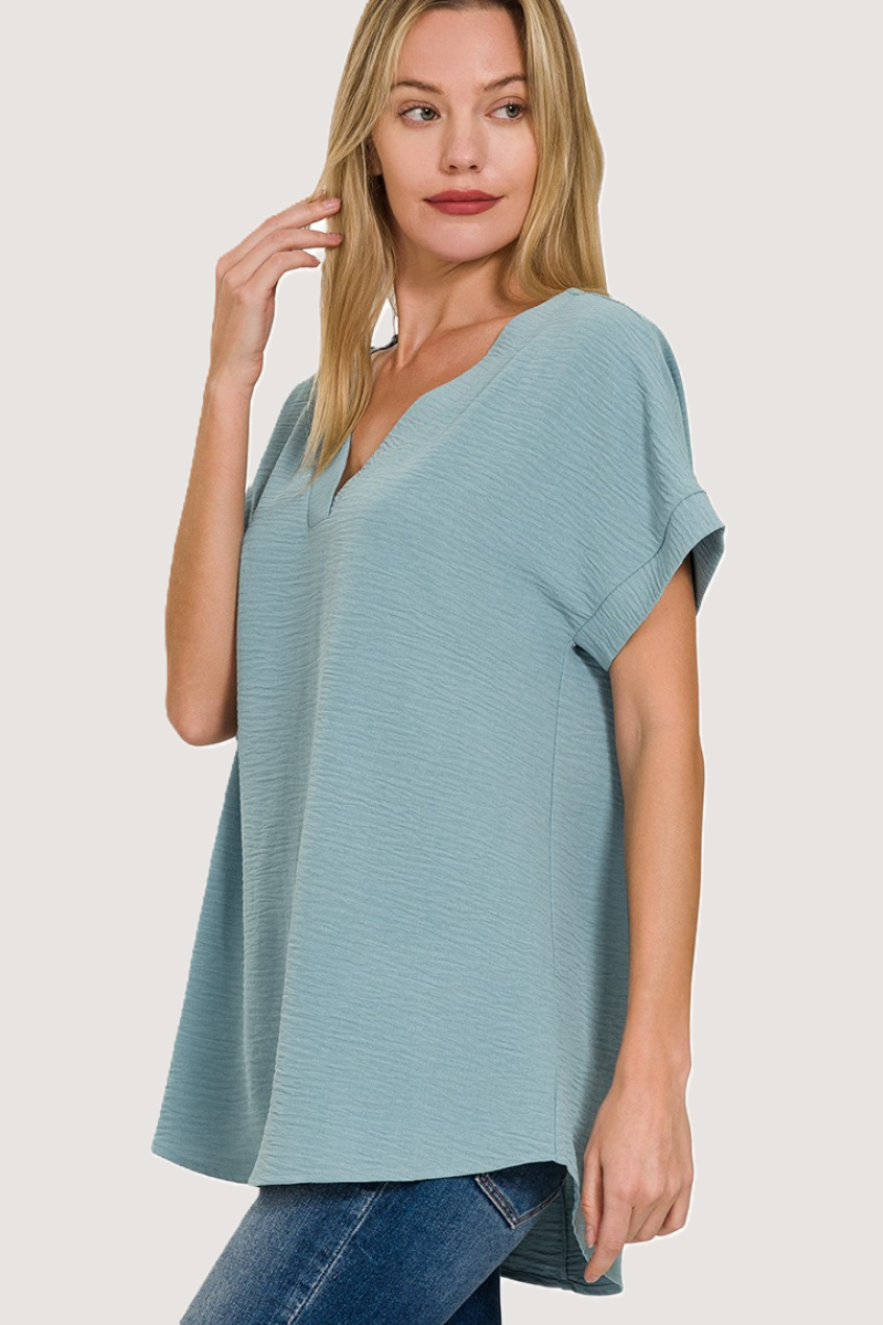 eco-friendly blue grey woven airflow V-neck top with hi-low hem