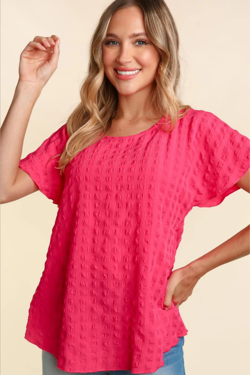 Lightweight pink blouse with bubble check plaid textured look.