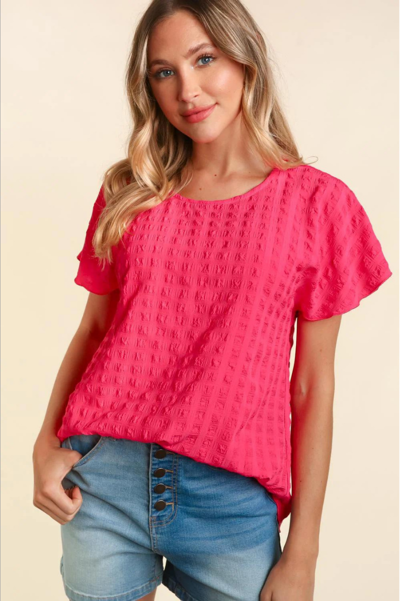 Lightweight pink blouse with bubble check plaid textured look.