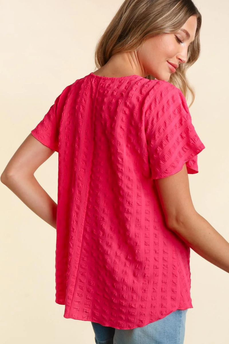 Lightweight pink blouse with bubble check plaid textured look.