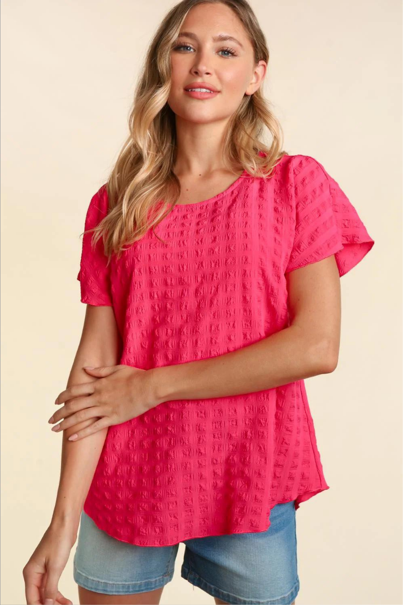 Lightweight pink blouse with bubble check plaid textured look.