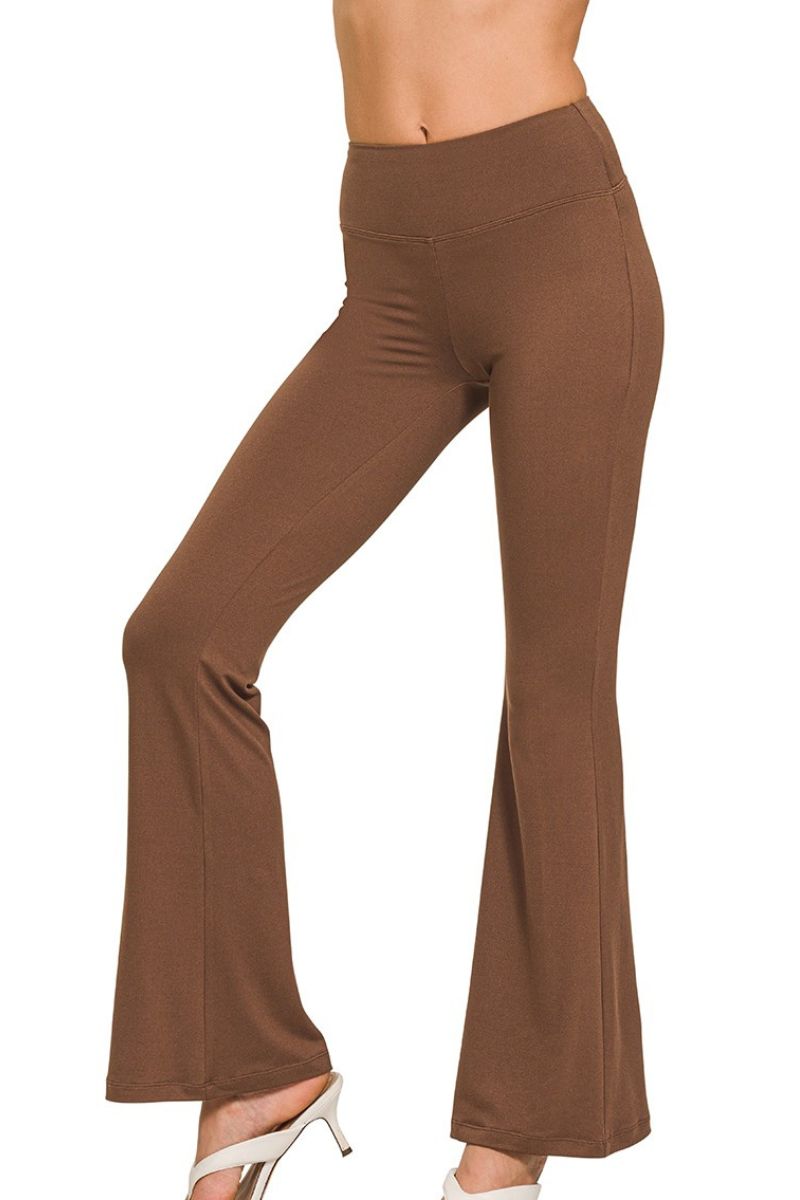 Brown flared pants on a white background