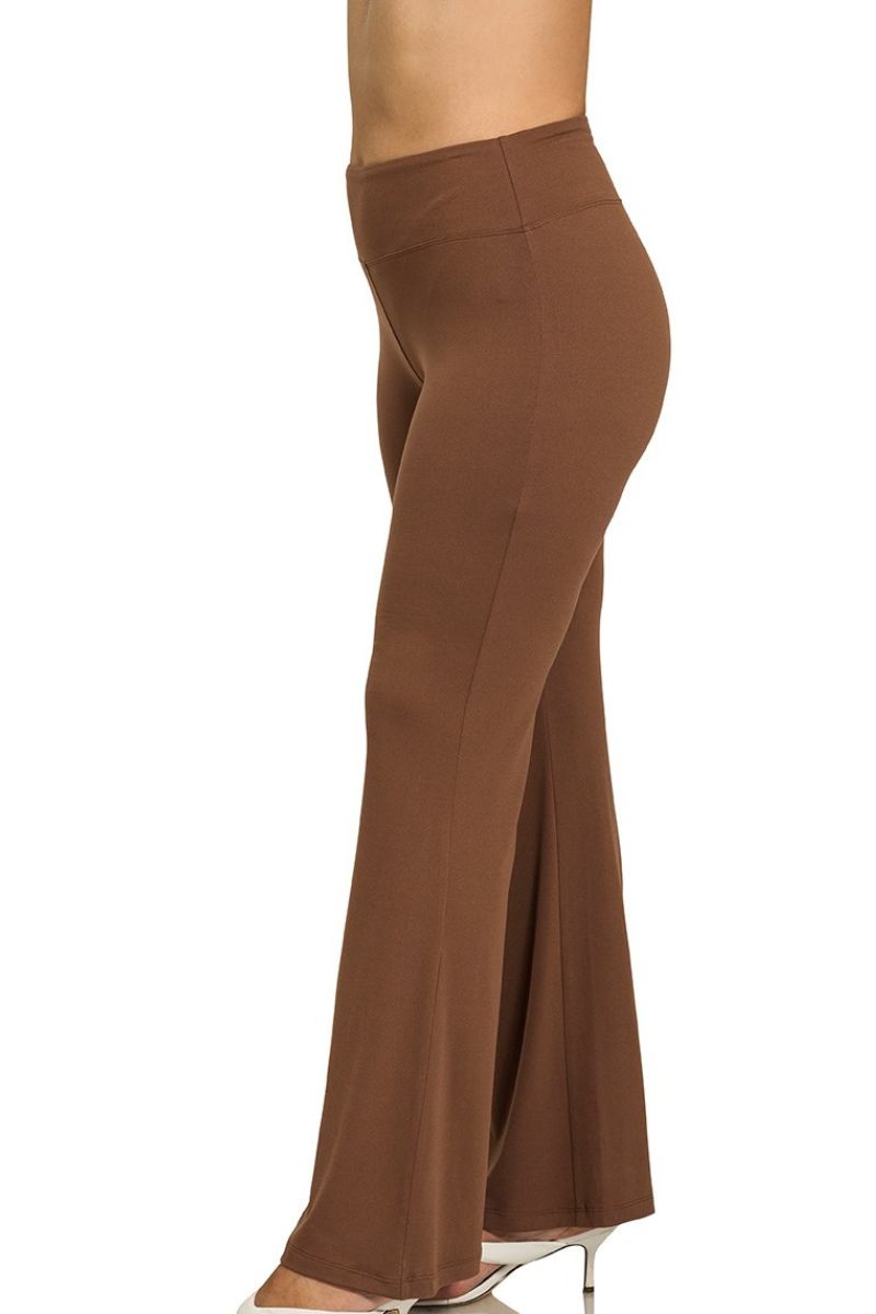 Brown flared pants on a white background