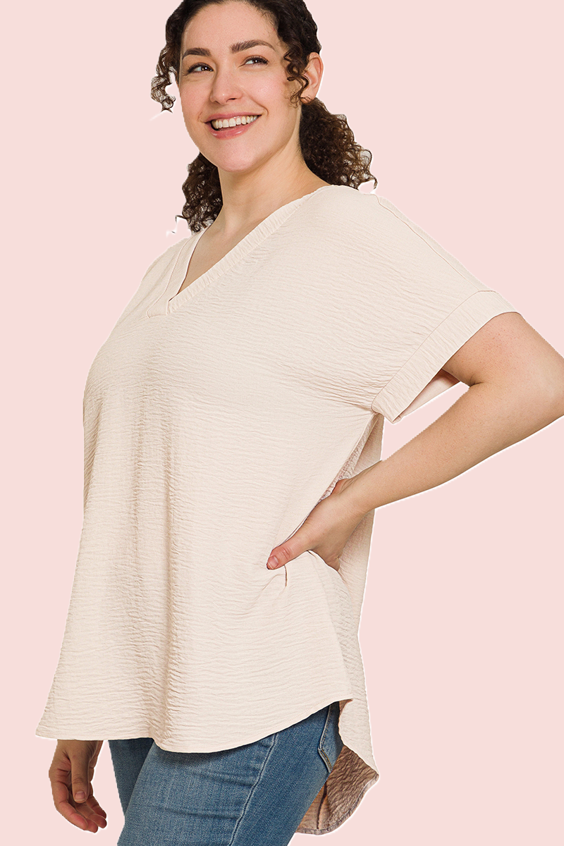 eco-friendly sand beige V-neck blouse with hi-low hem and woven airflow design