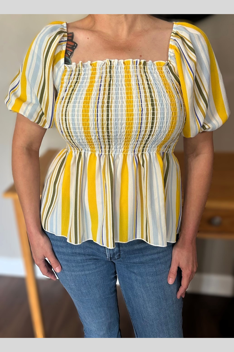 fun and flirty striped ruched blouse with babydoll look