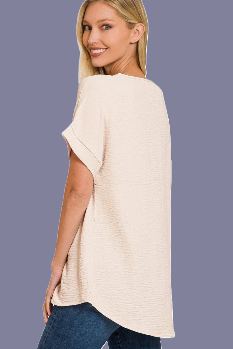 eco-friendly sand beige V-neck blouse with hi-low hem and woven airflow design