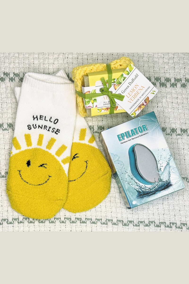ecofriendly sustainable spa gift set with socks, epilator, handmade soap, and crocheted washcloth