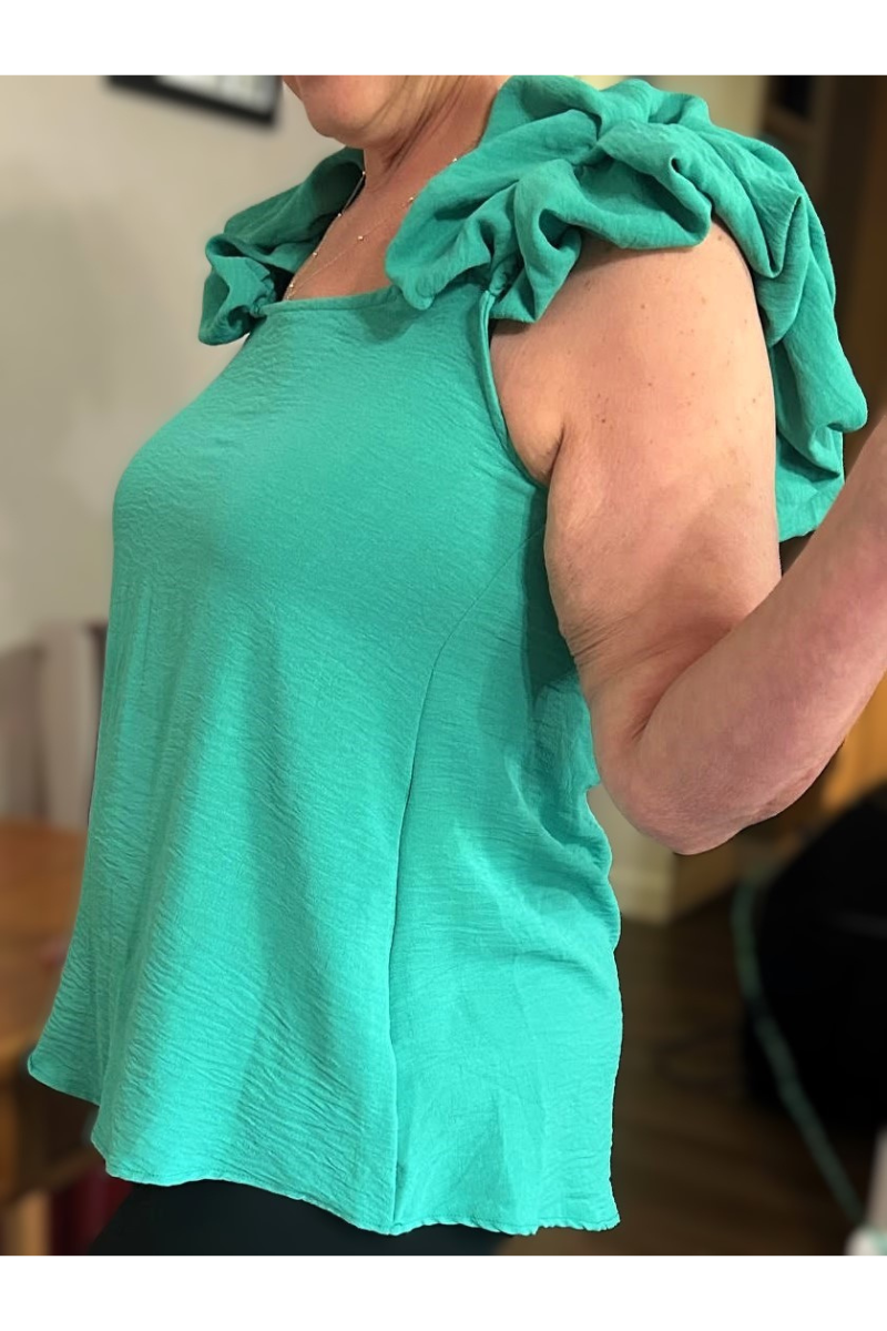 mint green blouse with balloon ruffle sleeves
