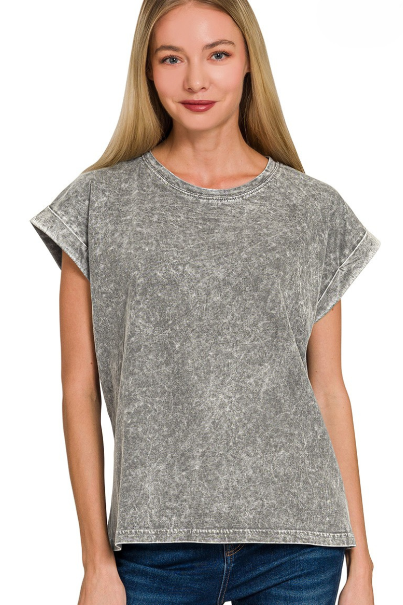 Woman wearing an ash black washed t-shirt on a white background