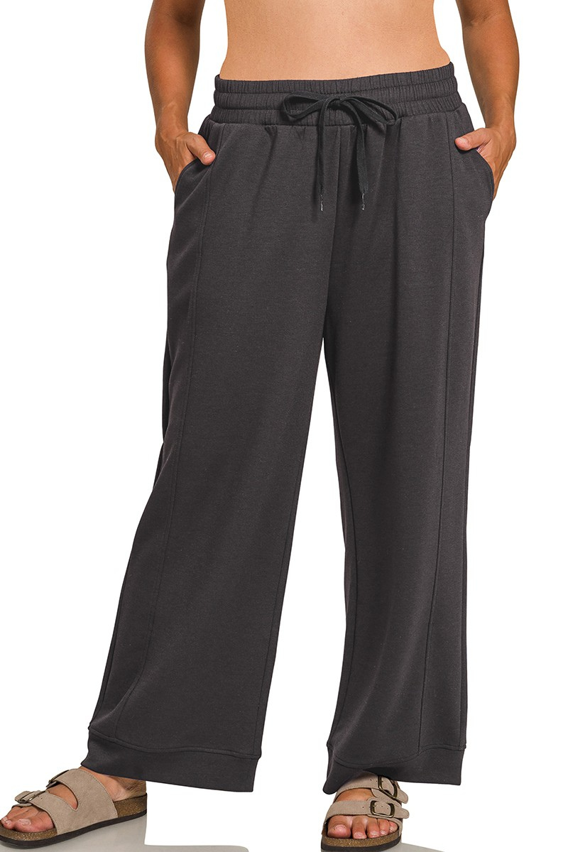 Black wide-leg pants with a drawstring waist on a white background