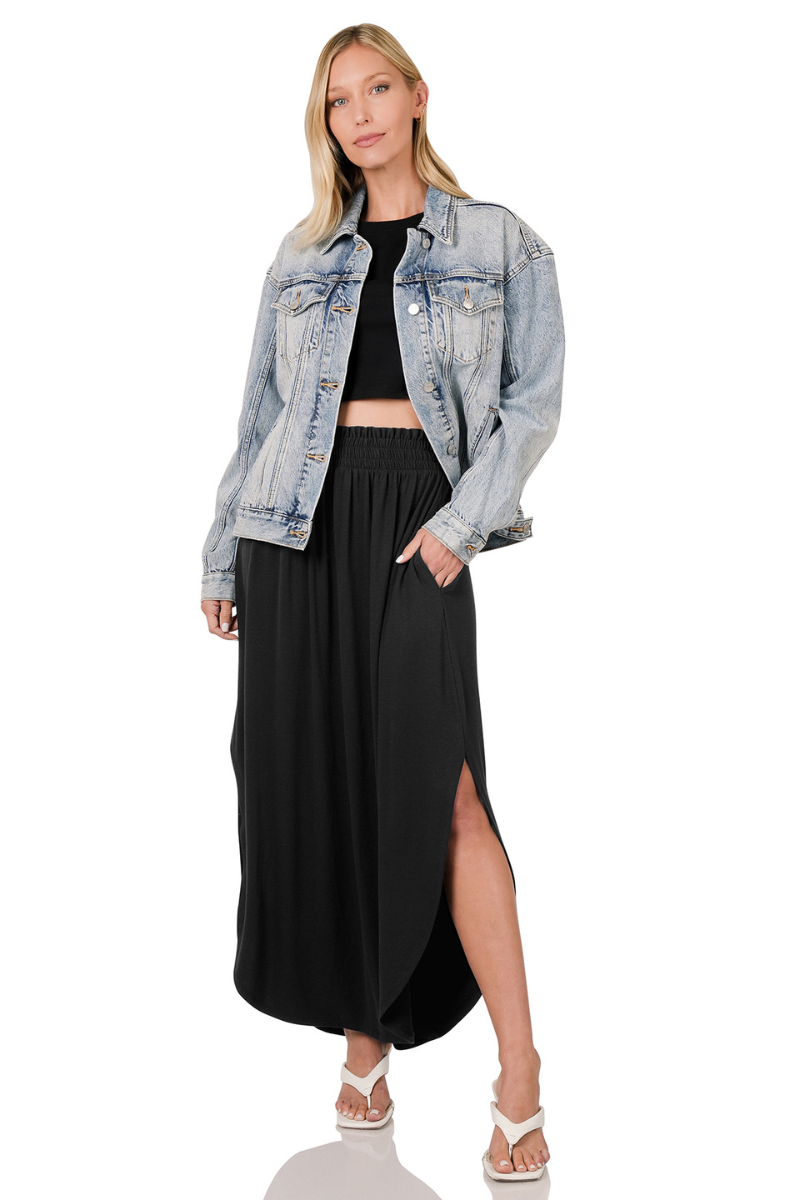 eco-friendly black smocked waist maxi skirt with side slits and pockets