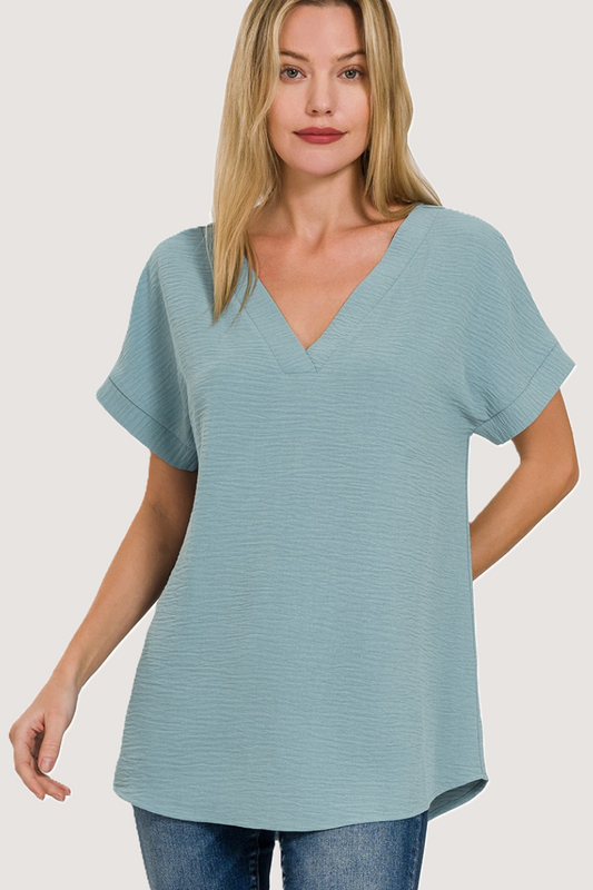 eco-friendly blue grey woven airflow V-neck top with hi-low hem