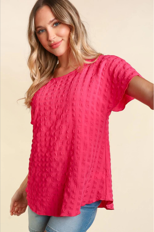 Lightweight pink blouse with bubble check plaid textured look.