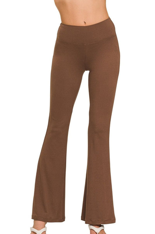 Brown flared pants on a white background