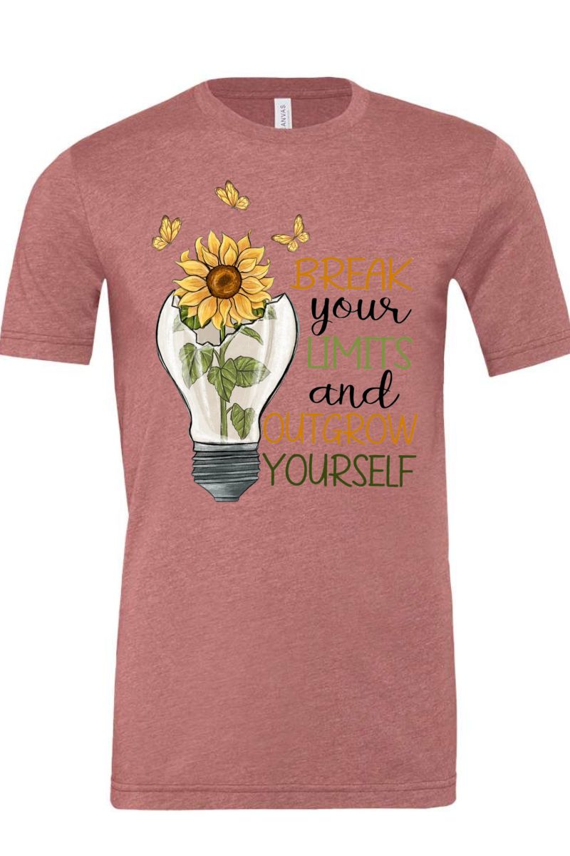 Red t-shirt with sunflower design and motivational text on a white background