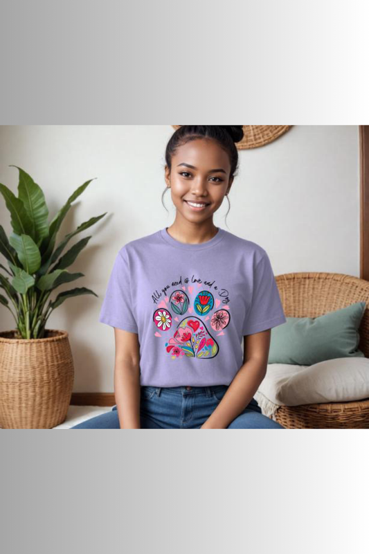 Eco-friendly Bella + Canvas unisex tee with floral paw print design and the caption "All you need is love and a Dog"