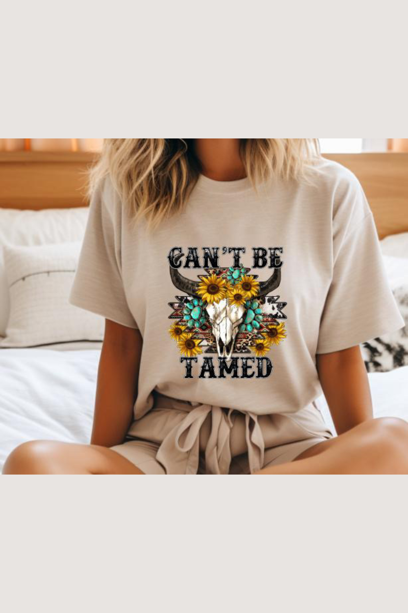 Eco-friendly Bella + Canvas unisex tee with Western design and the caption "Can't Be Tamed"