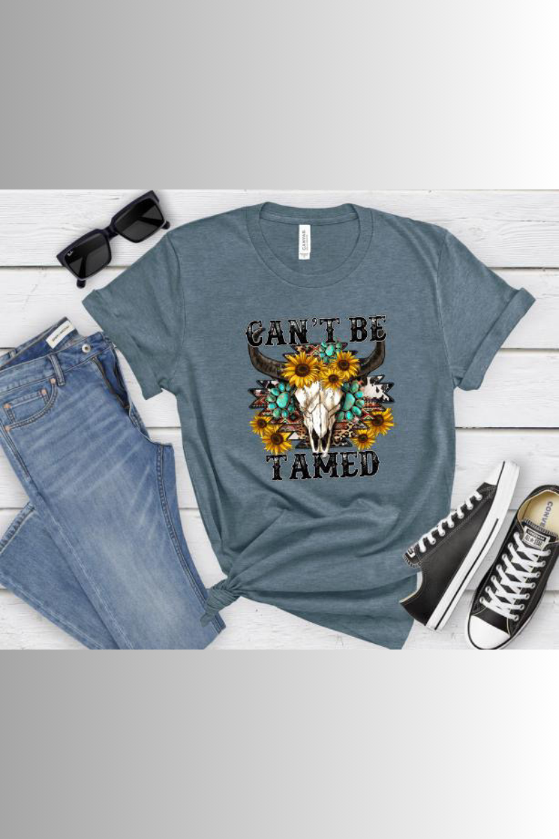 Eco-friendly Bella + Canvas unisex tee with Western design and the caption "Can't Be Tamed"