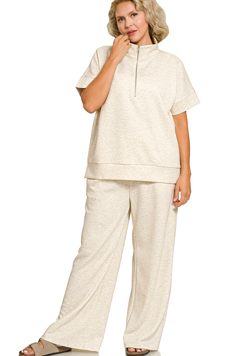 Woman wearing a beige outfit on a white background
