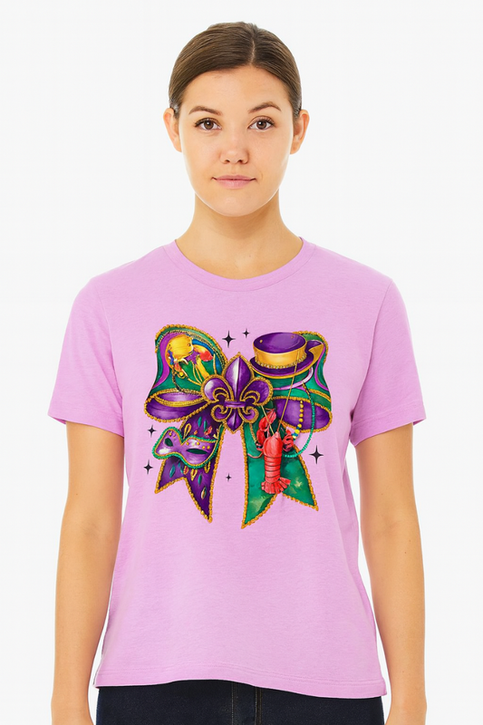 Woman wearing a pink t-shirt with a colorful graphic design on a white background