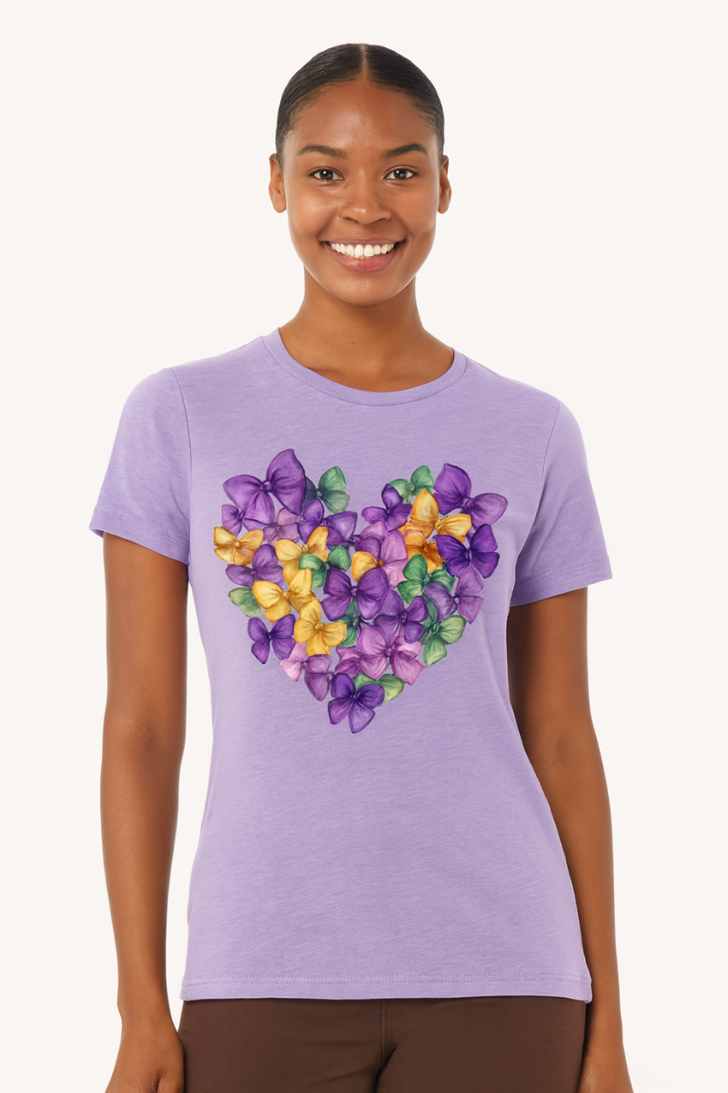 Woman wearing a purple t-shirt with a colorful heart design on a white background