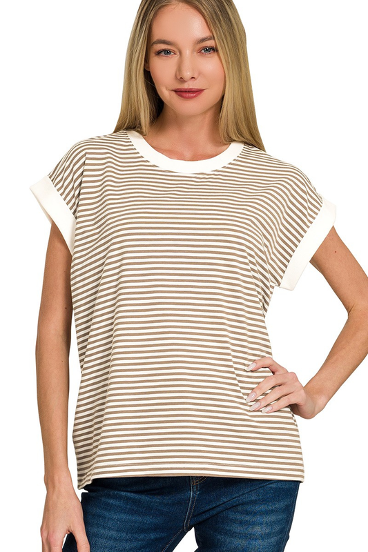Woman wearing a beige and white striped shirt on a white background