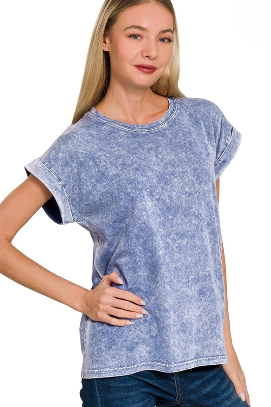 Woman wearing a blue acid-wash t-shirt on a white background