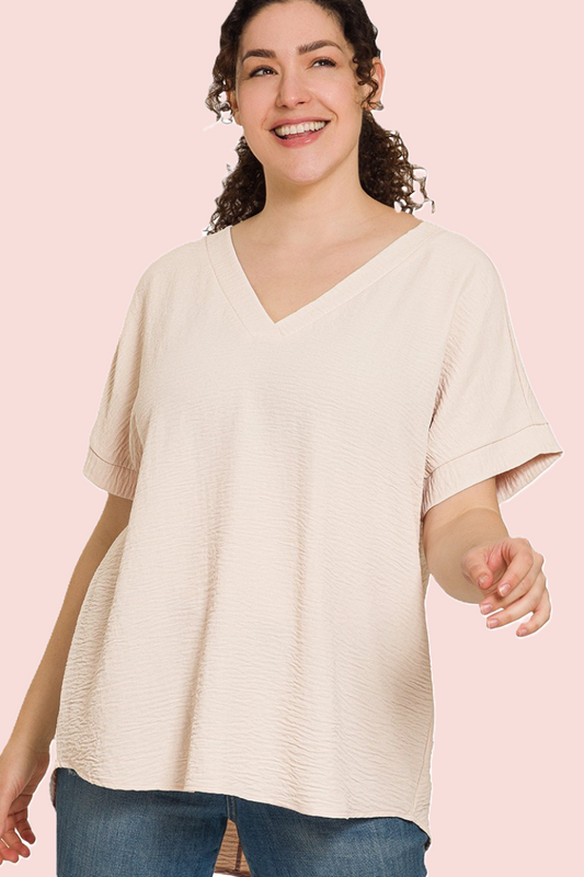 eco-friendly sand beige V-neck blouse with hi-low hem and woven airflow design