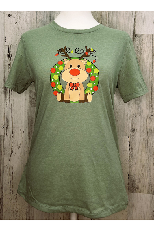 Eco-friendly ladies relaxed fit holiday tee in heather sage, adorable reindeer tangled in lights sitting in wreath.