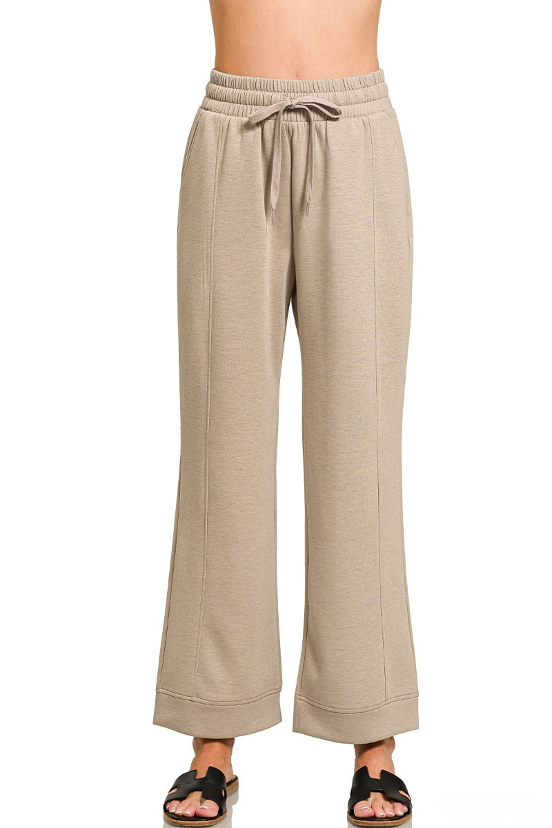 Beige wide-leg pants with a drawstring waist on a white background