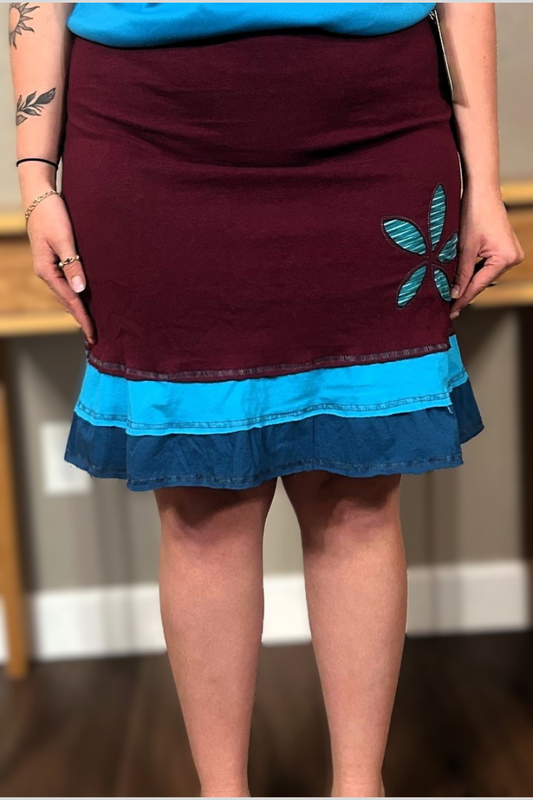 A flirty handmade upcycled cotton three-layer applique skirt in maroon.