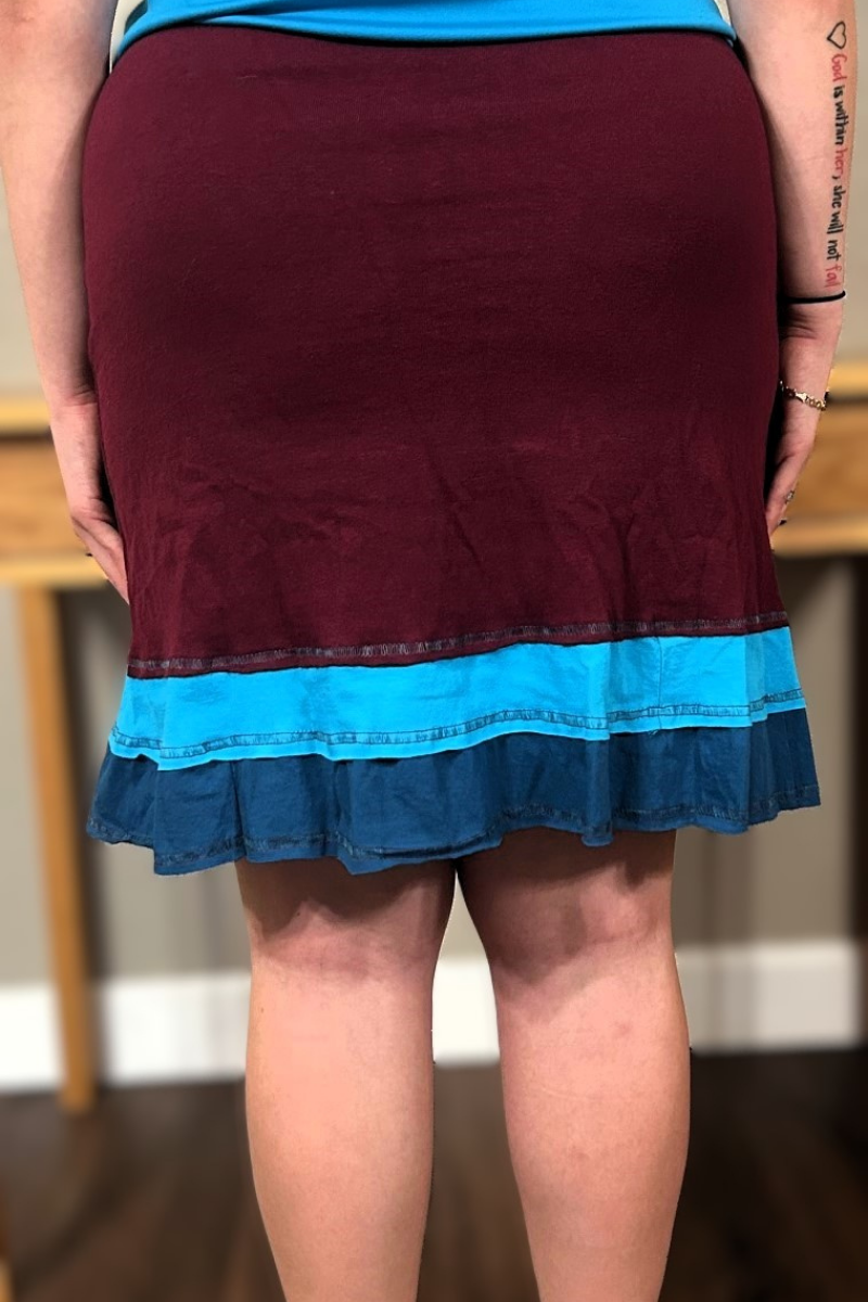 A flirty handmade upcycled cotton three-layer applique skirt in maroon.