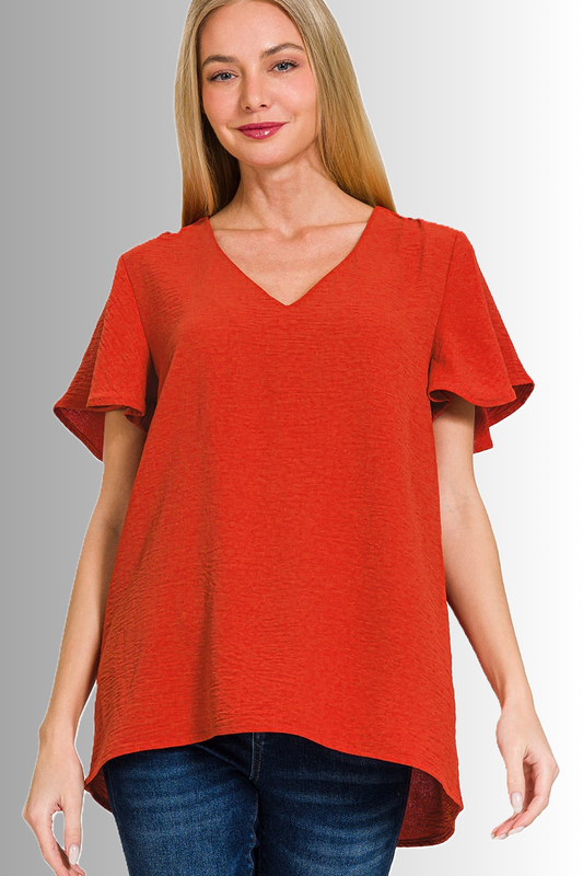 Zenana sustainable eco-friendly woven V-neck blouse with flutter sleeves in tomato color, flowy and elegant